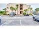 Three-story building with palm trees and parking at 1582 S Waccamaw Dr. # 10, Murrells Inlet, SC 29576