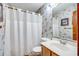 Clean bathroom with shower/tub combo and updated vanity at 1582 S Waccamaw Dr. # 10, Murrells Inlet, SC 29576