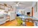 Kitchen with white cabinets, appliances, and dining area at 1582 S Waccamaw Dr. # 10, Murrells Inlet, SC 29576