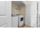 Convenient laundry room with washer and dryer, and built-in shelving at 444 Papyrus Circle # 444, Little River, SC 29566