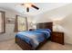 Comfortable bedroom with carpeted floors, a ceiling fan and ample closet space at 444 Papyrus Circle # 444, Little River, SC 29566