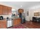 Modern kitchen with granite countertops, stainless steel appliances, and wood cabinets at 444 Papyrus Circle # 444, Little River, SC 29566