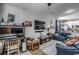 Living room with comfortable seating, large TV, and home office area at 3507 Fountain Ln., Myrtle Beach, SC 29577