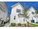 White two-story house with a landscaped yard and walkway at 3507 Fountain Ln., Myrtle Beach, SC 29577