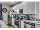 Modern kitchen with stainless steel appliances and white cabinetry at 3507 Fountain Ln., Myrtle Beach, SC 29577