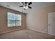 Well-lit bedroom with neutral walls, carpet, and ceiling fan at 1525 Palmina Loop # B, Myrtle Beach, SC 29588