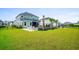 Spacious backyard with a large lawn, patio, and pool at 2056 Summer Rose Ln., Myrtle Beach, SC 29579