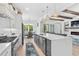 Clean kitchen with white cabinets, quartz countertops, and a large island at 2056 Summer Rose Ln., Myrtle Beach, SC 29579