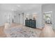 Light and airy hallway with hardwood floors and decorative rug at 2056 Summer Rose Ln., Myrtle Beach, SC 29579