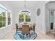 Bright dining area with round table and four chairs, overlooking backyard at 2056 Summer Rose Ln., Myrtle Beach, SC 29579