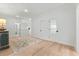 Light-filled hallway with hardwood floors and stylish light fixtures at 2056 Summer Rose Ln., Myrtle Beach, SC 29579