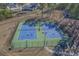 Two well-lit tennis courts with basketball hoop at 2056 Summer Rose Ln., Myrtle Beach, SC 29579