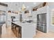 Modern kitchen with white cabinets, a large island, and stainless steel appliances at 2056 Summer Rose Ln., Myrtle Beach, SC 29579
