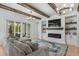 Open living space featuring exposed wooden beams and a modern fireplace at 2056 Summer Rose Ln., Myrtle Beach, SC 29579