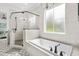Bathroom with soaking tub, walk in shower, and hexagon tile floor at 2056 Summer Rose Ln., Myrtle Beach, SC 29579
