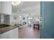 Open concept living space with light flooring and a light blue wall at 14290 Ocean Hwy. # 208, Pawleys Island, SC 29585