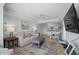 Open concept living room, dining area, and kitchen with modern appliances at 14290 Ocean Hwy. # 208, Pawleys Island, SC 29585