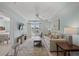 Bright living room with comfy sofa, large TV, and access to balcony at 14290 Ocean Hwy. # 208, Pawleys Island, SC 29585