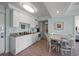 Efficient galley kitchen with white cabinets and granite countertops at 14290 Ocean Hwy. # 208, Pawleys Island, SC 29585
