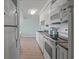 White kitchen with granite countertops and stainless steel appliances at 14290 Ocean Hwy. # 208, Pawleys Island, SC 29585