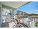 Balcony overlooks a resort pool and playground area at 14290 Ocean Hwy. # 208, Pawleys Island, SC 29585
