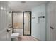 Clean bathroom with a walk-in shower and tiled floors at 14290 Ocean Hwy. # 208, Pawleys Island, SC 29585