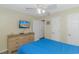 Bright bedroom with a dresser, TV, and comfortable bed at 6001 - 1819 S Kings Hwy., Myrtle Beach, SC 29575