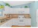 White kitchen with ample counter space and built-in appliances at 6001 - 1819 S Kings Hwy., Myrtle Beach, SC 29575