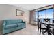 Living room features ocean view, sofa, and dining table at 1501 S Ocean Blvd. # 1135, Myrtle Beach, SC 29577