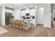 Modern kitchen with white cabinets, island, and stainless steel appliances at 616 Blackthorne Circle Nw, Calabash, NC 28467