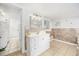 Well-lit bathroom with a vanity and a view into the laundry room at 605 36Th Ave. S, North Myrtle Beach, SC 29582