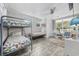 Bedroom with a bunk bed, two comfy chairs and access to a balcony at 605 36Th Ave. S, North Myrtle Beach, SC 29582
