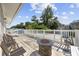Relaxing deck with fire pit, chairs, and loungers, offering scenic views at 605 36Th Ave. S, North Myrtle Beach, SC 29582