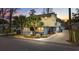 Two-story beach house with palm trees, a paved driveway, and a landscaped yard at 605 36Th Ave. S, North Myrtle Beach, SC 29582