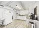 White kitchen with granite countertops and stainless steel appliances at 605 36Th Ave. S, North Myrtle Beach, SC 29582