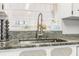 Modern kitchen sink with a high-neck faucet and granite countertop at 605 36Th Ave. S, North Myrtle Beach, SC 29582