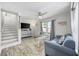 Bright living room features stylish furniture, a large TV, and hardwood floors at 605 36Th Ave. S, North Myrtle Beach, SC 29582