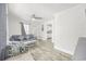 Living room with a comfy couch, a view to the kitchen and hardwood floors at 605 36Th Ave. S, North Myrtle Beach, SC 29582