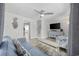 Living room with hardwood floors, comfy seating, and a view into the kitchen at 605 36Th Ave. S, North Myrtle Beach, SC 29582
