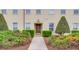 Front entrance of a building with manicured landscaping and walkway at 4508-E Ailsa Ct. # 4508-E, Myrtle Beach, SC 29579