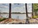Peaceful waterfront view with trees and a sign at 4508-E Ailsa Ct. # 4508-E, Myrtle Beach, SC 29579