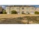 Back exterior view of a multi-unit building with a grassy lawn at 4508-E Ailsa Ct. # 4508-E, Myrtle Beach, SC 29579