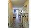 Efficient kitchenette with stove, microwave, and small table at 1207 S Ocean Blvd. # 50505, Myrtle Beach, SC 29577