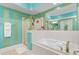 Stylish bathroom with a large tub, shower, and teal accents at 2180 Waterview Dr. # 634, North Myrtle Beach, SC 29582