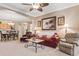 Open living room with red leather sofa and view to dining area at 2180 Waterview Dr. # 634, North Myrtle Beach, SC 29582