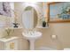 Elegant bathroom with pedestal sink and oval mirror at 2180 Waterview Dr. # 634, North Myrtle Beach, SC 29582