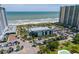 Aerial view of resort, pool, beach, and ocean at 410 Melrose Pl. # 309, Myrtle Beach, SC 29572