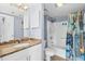Clean bathroom with tub/shower combo and granite countertop vanity at 410 Melrose Pl. # 309, Myrtle Beach, SC 29572