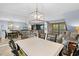 Open concept dining area with seating for six and view into living room at 410 Melrose Pl. # 309, Myrtle Beach, SC 29572