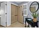 Condo entry with light walls, wood floors, and a console table at 410 Melrose Pl. # 309, Myrtle Beach, SC 29572
